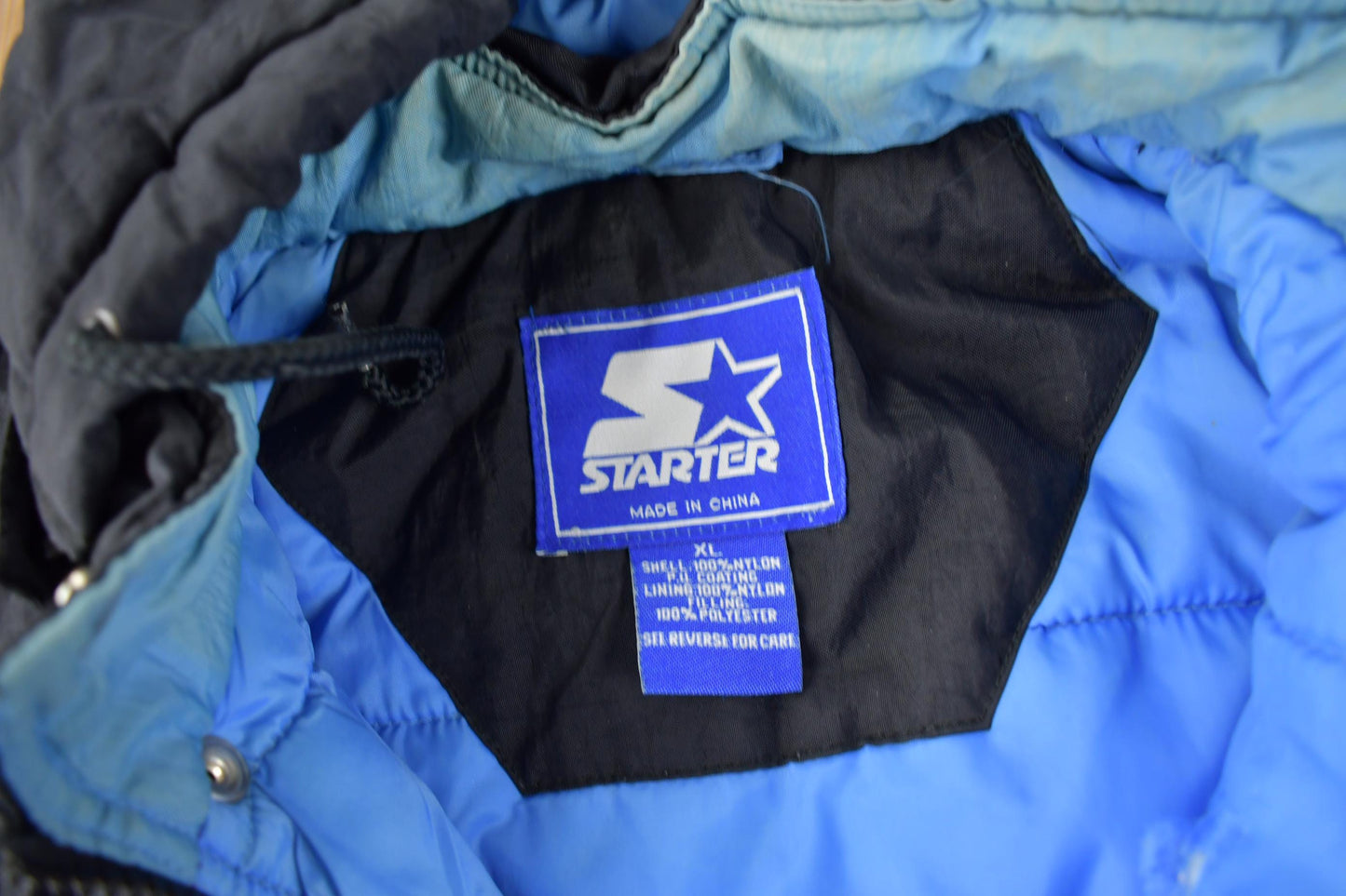 Vintage 1990s University of North Carolina Tar Heels Collegiate NCAA Quarter Zip Starter Jacket from propervintagecanada