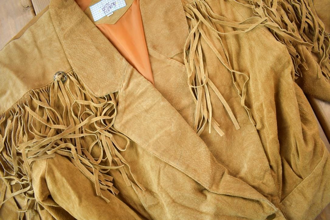 Vintage 1990s Very Trendy Brown Suede Leather Fringe Jacket Women's L from propervintagecanada