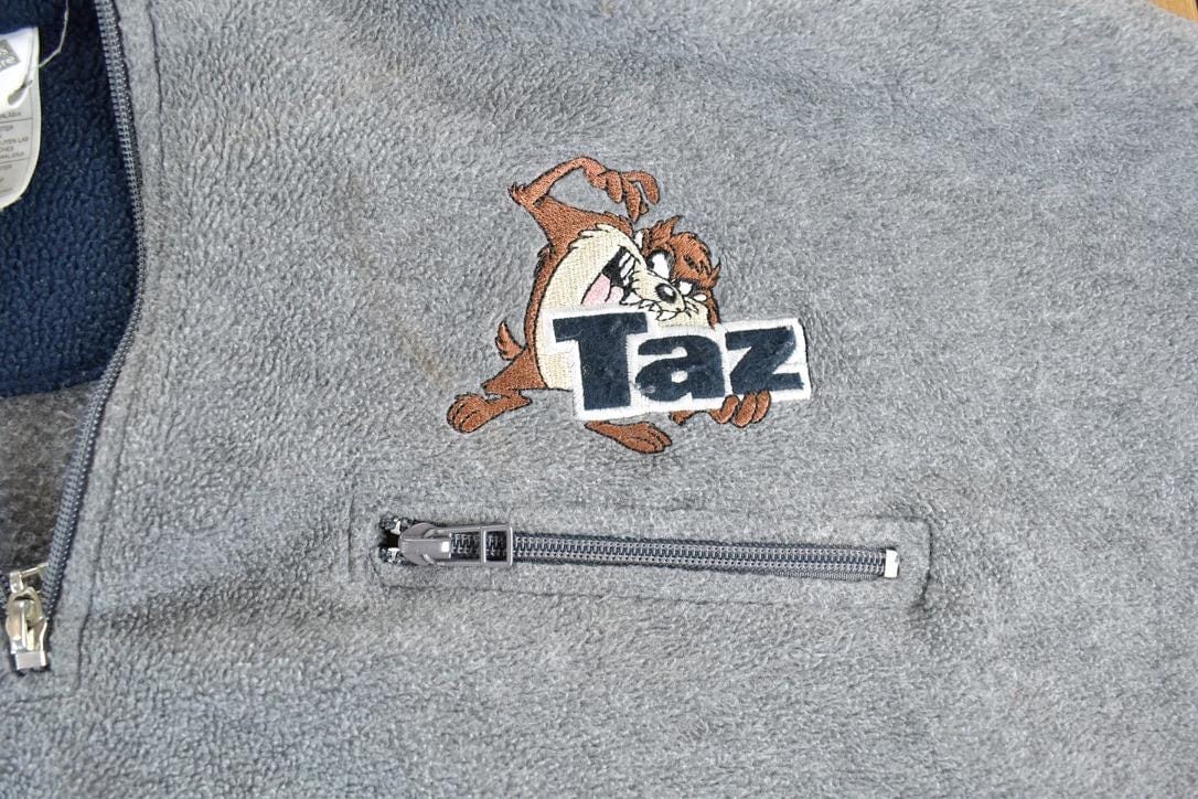 Vintage 1990s Warner Brothers Fleece Taz Embroidered Outdoorsman Sweater Men's 2XL from propervintagecanada