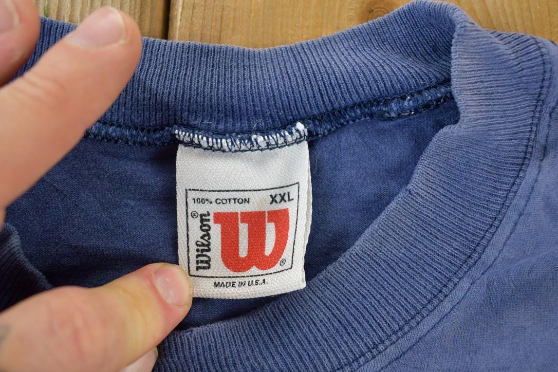 Vintage 1990s Wilson Souvenir Single Stitch Graphic Print T-Shirt Men's 2XL from propervintagecanada