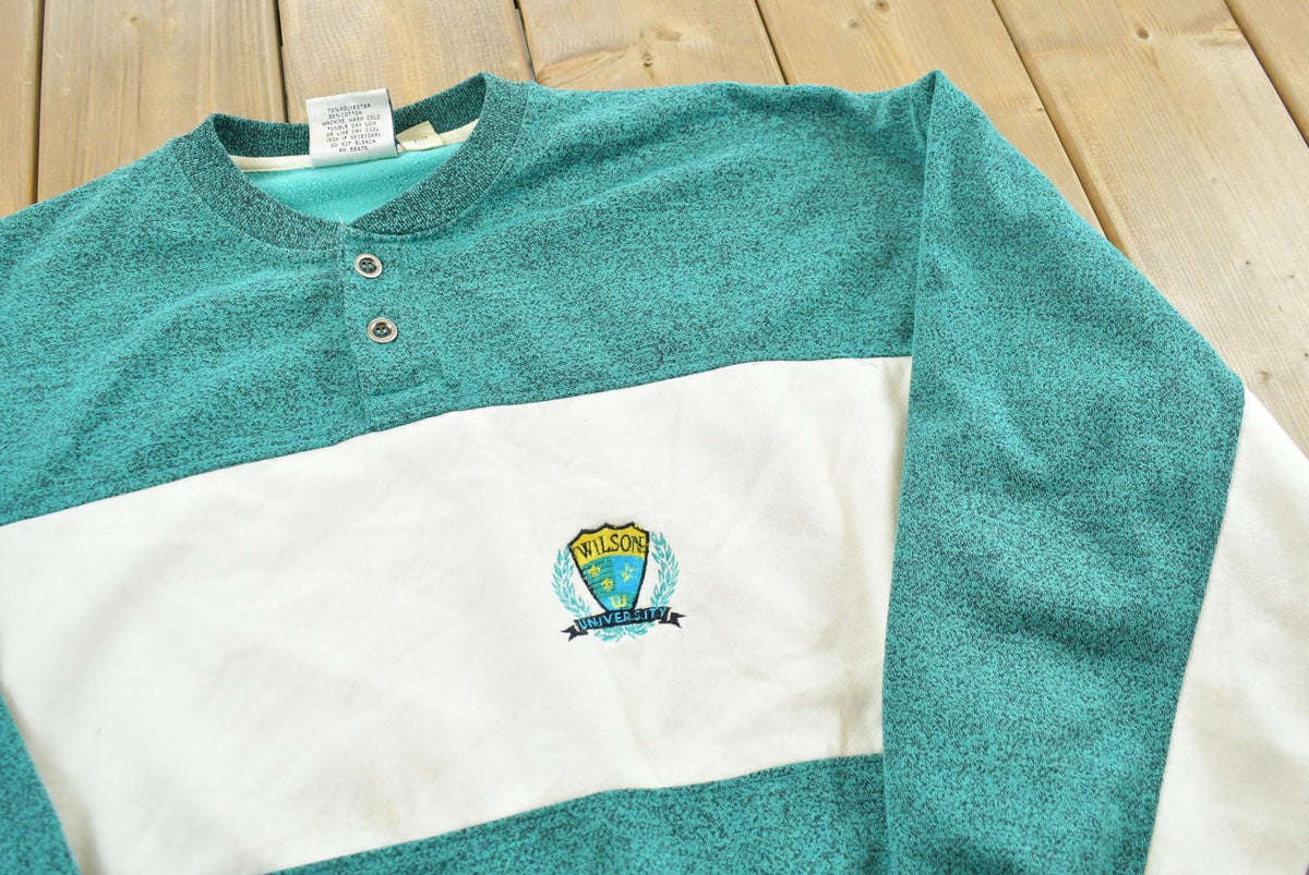 Vintage 1990s Wilson University Embroidered Henley Collar Sweatshirt Men's L from propervintagecanada