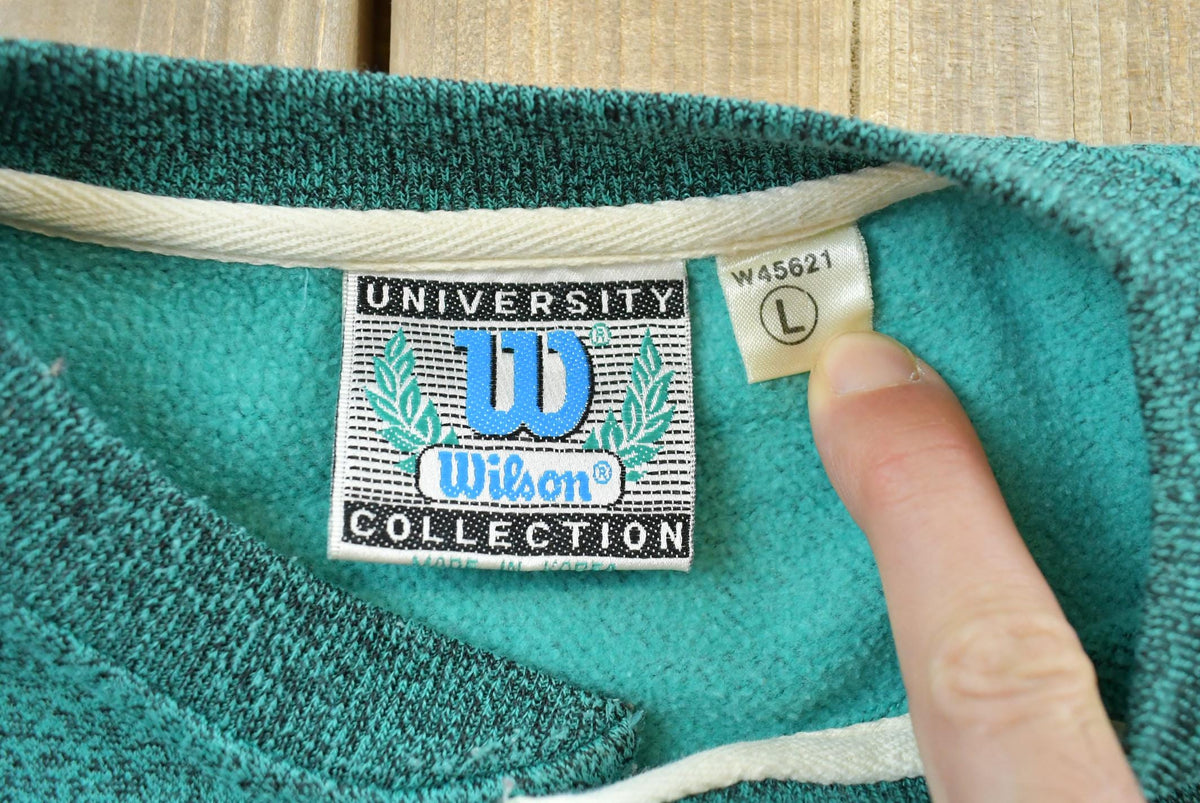 Vintage 1990s Wilson University Embroidered Henley Collar Sweatshirt Men's L from propervintagecanada
