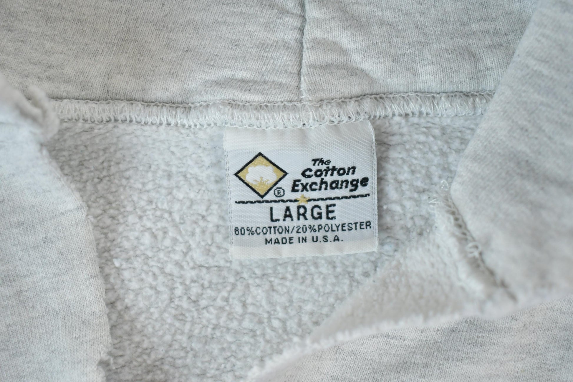 Vintage 1990s Winona State University Collegiate The Cotton Exchange Heavyweight Hoodie Men's Large from propervintagecanada