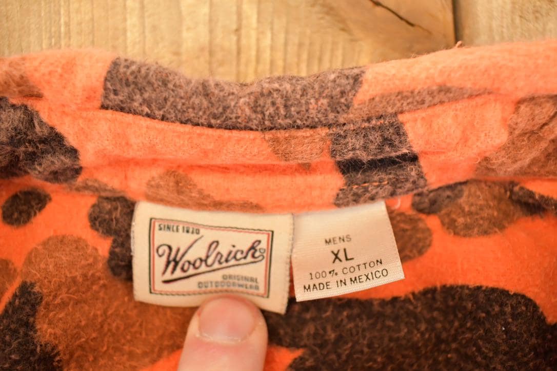 Vintage 1990s Woolrich Orange Camo Button Up Flannel Shirt Men's L from propervintagecanada