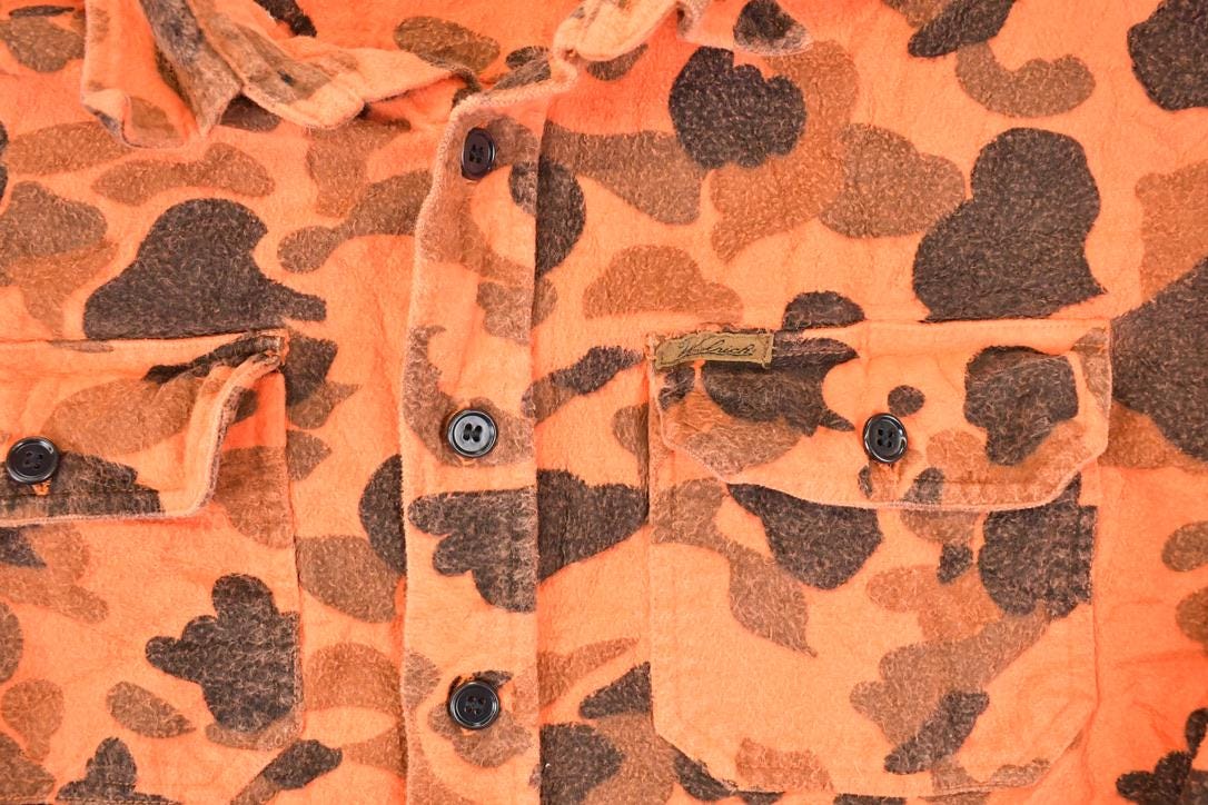 Vintage 1990s Woolrich Orange Camo Button Up Flannel Shirt Men's L from propervintagecanada