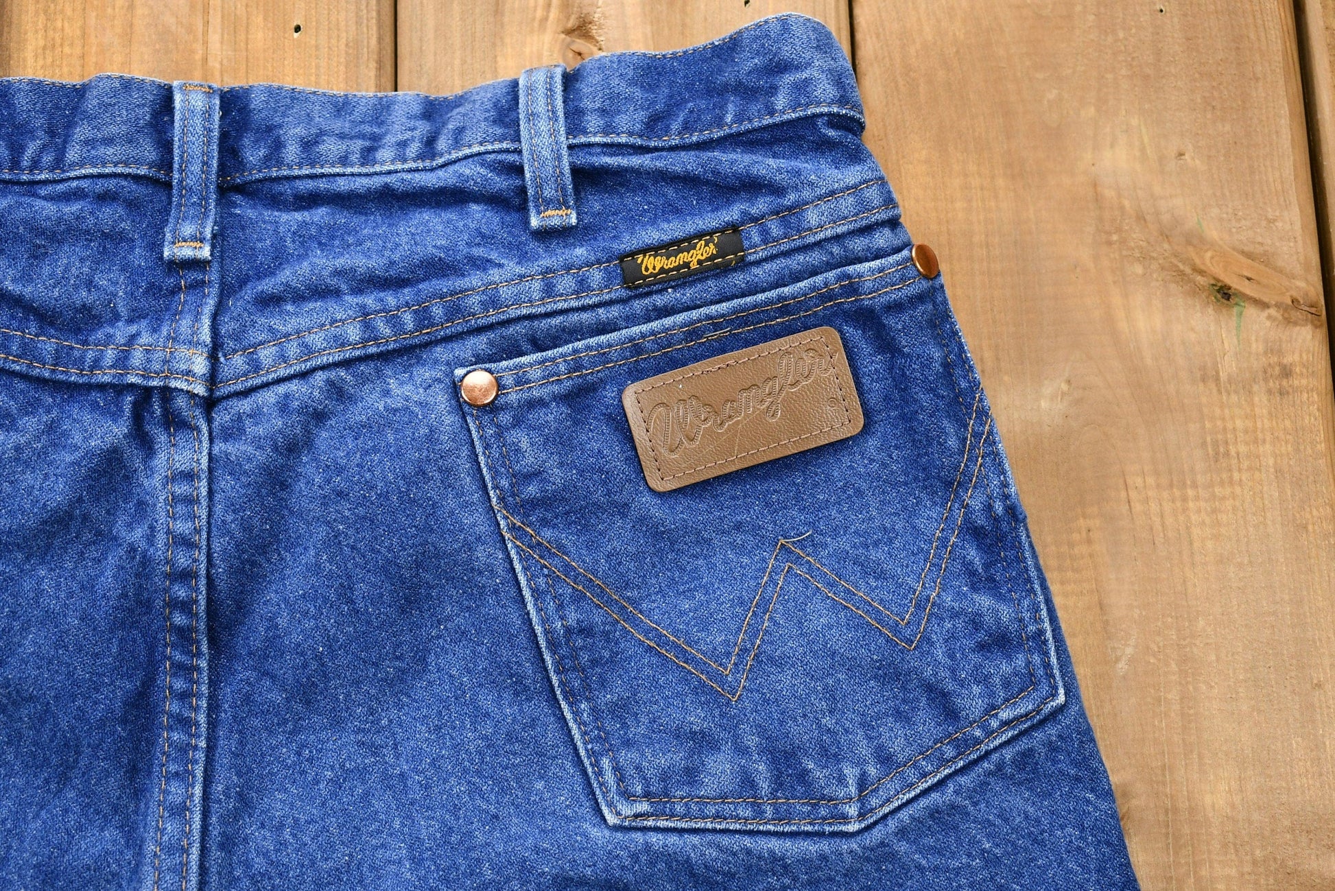 Vintage 1990s Wrangler Mid-Wash Bootcut Denim Jeans Men's 34 from propervintagecanada