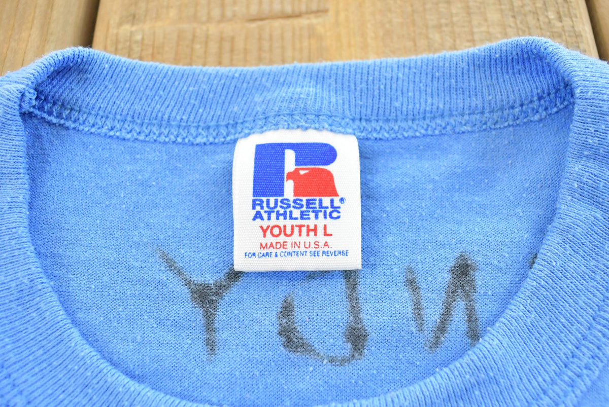 Vintage 1990s Youth Russell Athletic Eau Clair YMCA Girls Basketball T-Shirt Youth L from propervintagecanada