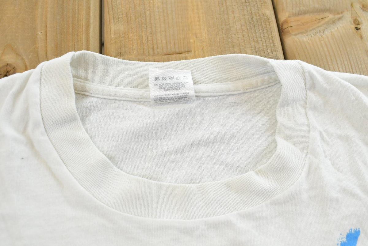Vintage 1990s Yukon Jack Perma Frost Schnapps Graphic T-Shirt Mens XL from propervintagecanada