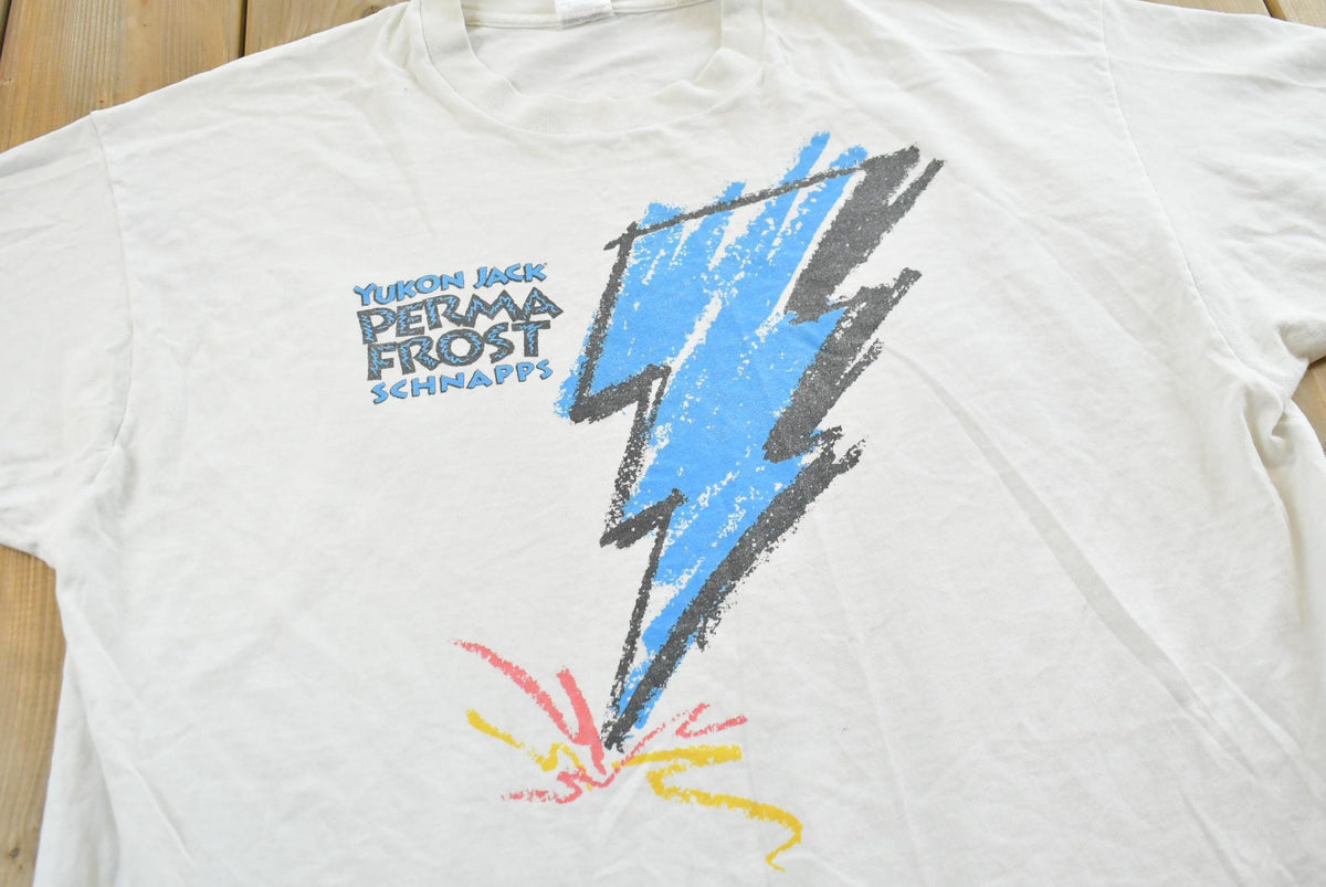 Vintage 1990s Yukon Jack Perma Frost Schnapps Graphic T-Shirt Mens XL from propervintagecanada