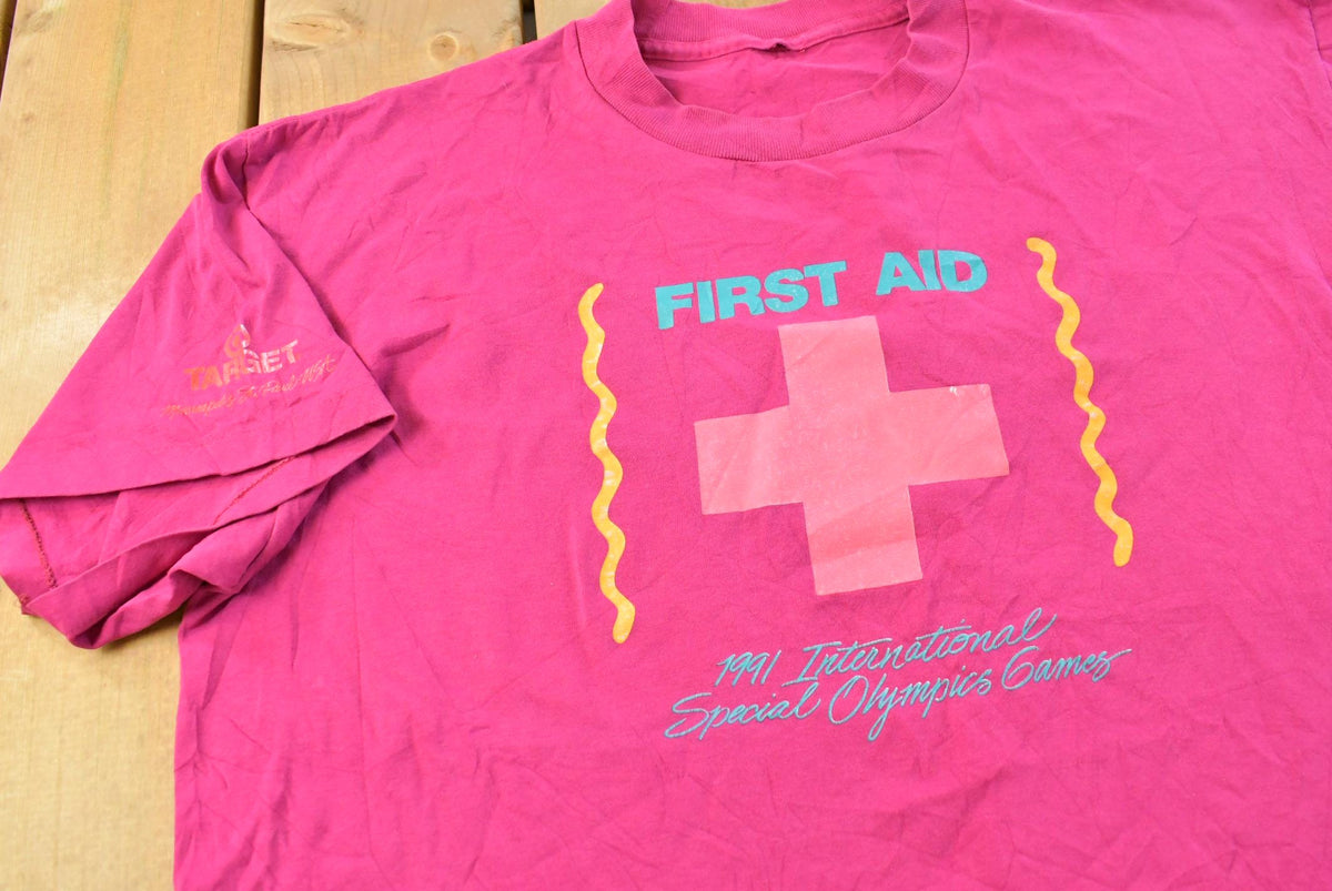 Vintage 1991 International Special Olympics First Aid T-Shirt Men's L from propervintagecanada