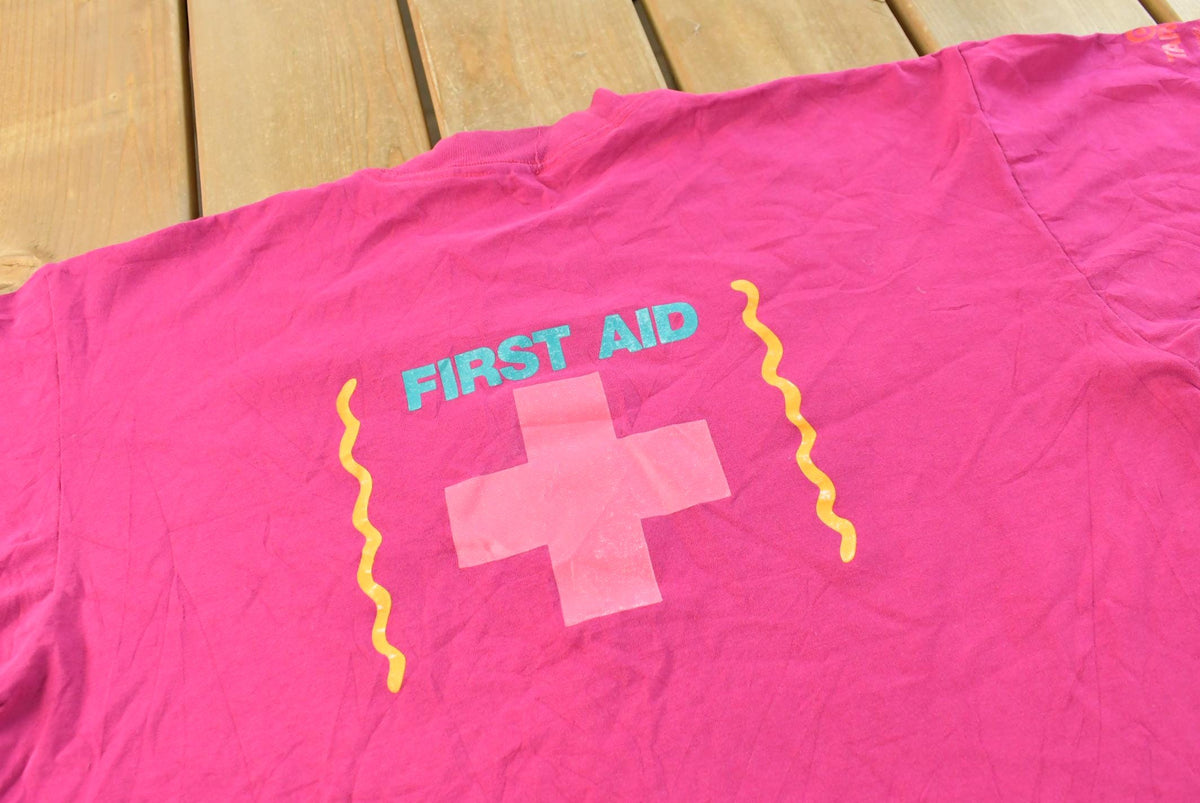 Vintage 1991 International Special Olympics First Aid T-Shirt Men's L from propervintagecanada