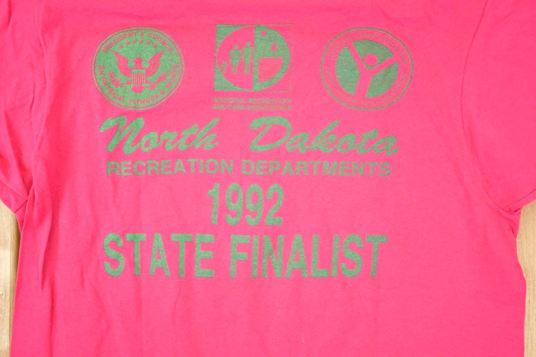 Vintage 1991 Screen Stars Best North Dakota Recreation Department Souvenir Travel T-Shirt Men's S from propervintagecanada