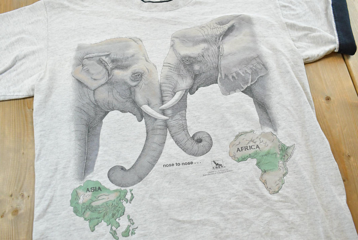Vintage 1992 Harlequin Elephants Asia Africa Animal T-Shirt Mens L from propervintagecanada