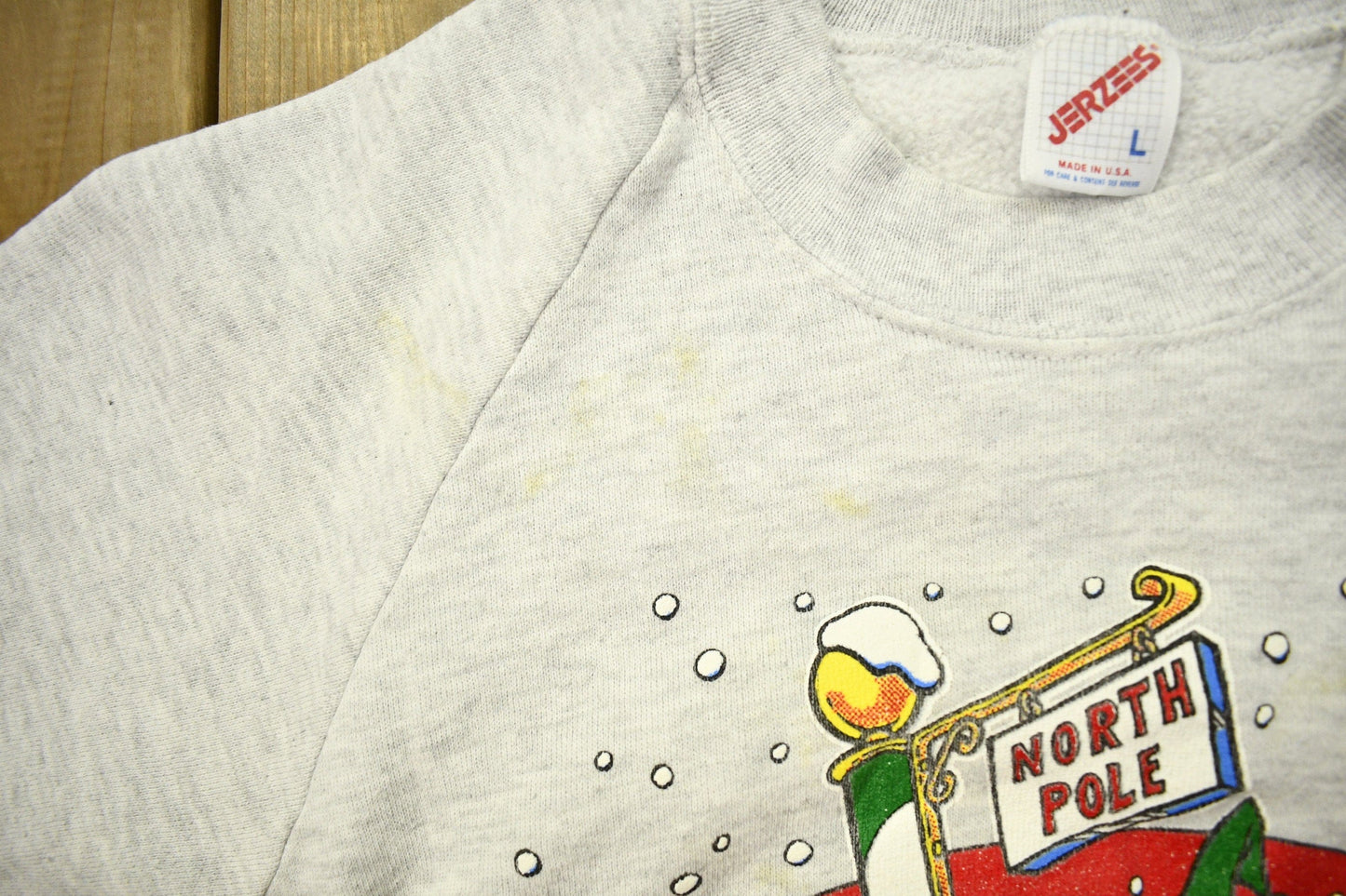 Vintage 1993 Looney Tunes North Pole Christmas Theme Raglan Crewneck Men's Medium from propervintagecanada