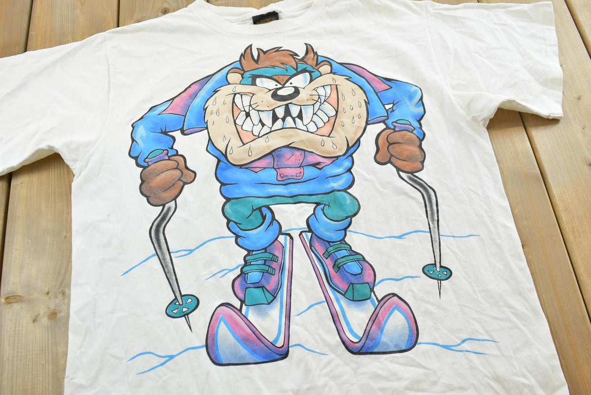 Vintage 1994 Taz Ski Looney Tunes Cartoon Graphic T-Shirt Mens L from propervintagecanada