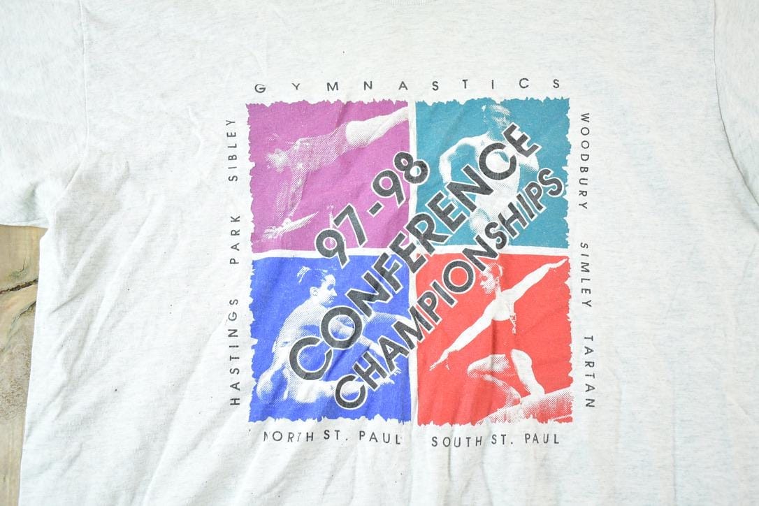 Vintage 1997 98 Conference Gymnastics Championships Souvenir T-Shirt Mens XL from propervintagecanada