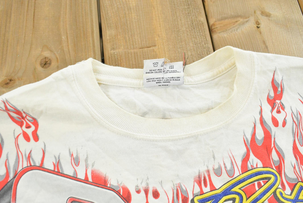 Vintage 1999 Rusty Wallace Harley Davidson All Over Print Flames NASCAR Racing T-Shirt Mens L from propervintagecanada