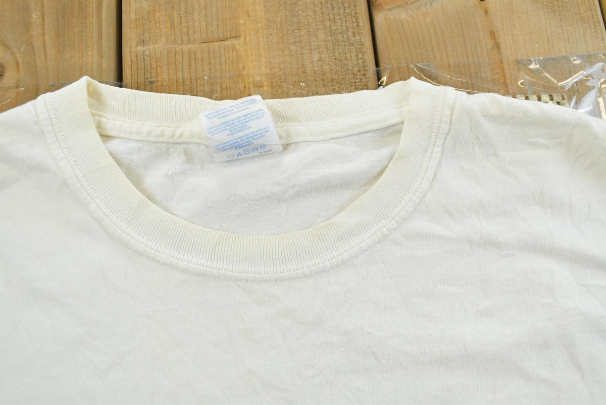 Vintage 2000s Bite Me Fishwear Catfish Promotional Souvenir Pocket T-Shirt Men's XL from propervintagecanada