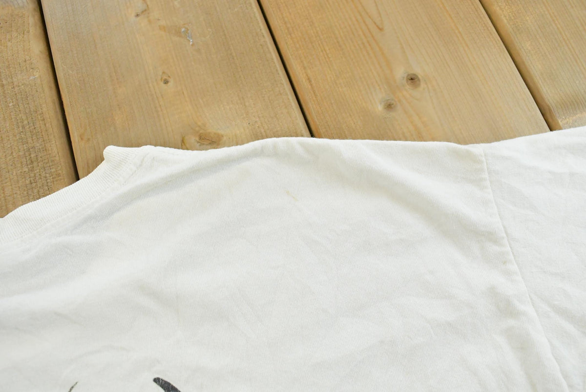 Vintage 2000s Bite Me Fishwear Catfish Promotional Souvenir Pocket T-Shirt Men's XL from propervintagecanada