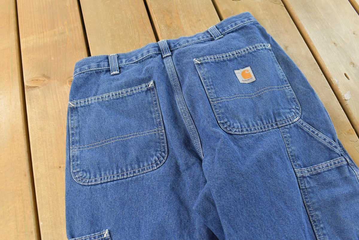 Vintage 2000s Carhartt Denim Blue Jeans Men's 28 x 28.5 from propervintagecanada