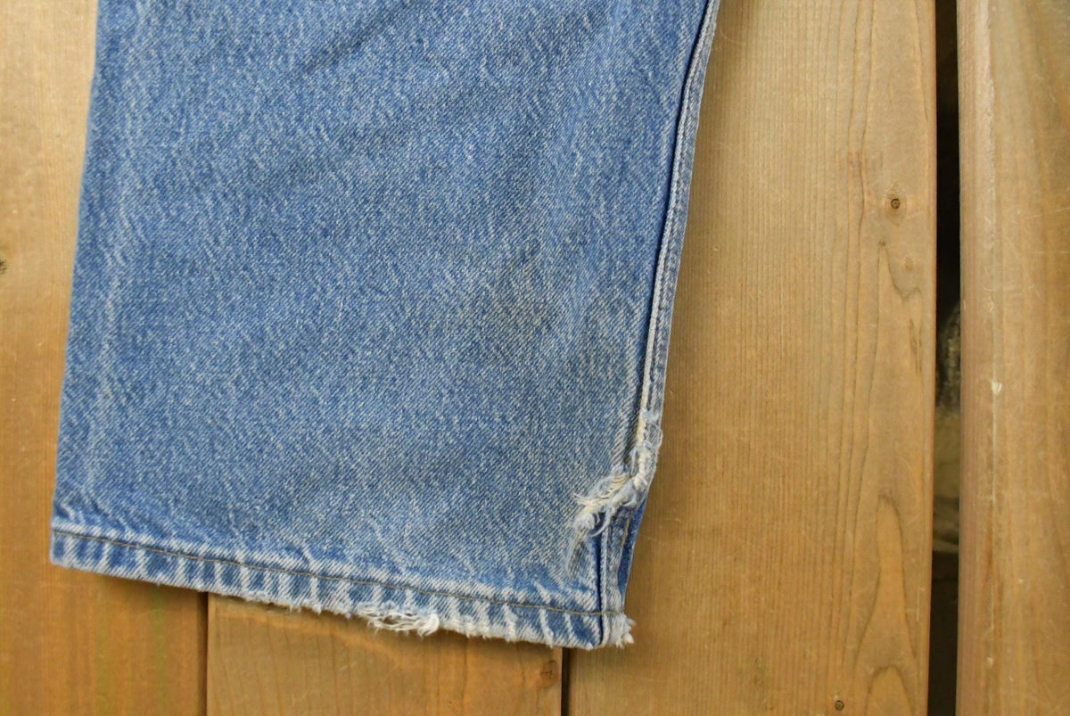 Vintage 2000s Carhartt Distressed Double Knee Denim Work Jeans Men's 31 x 29 from propervintagecanada