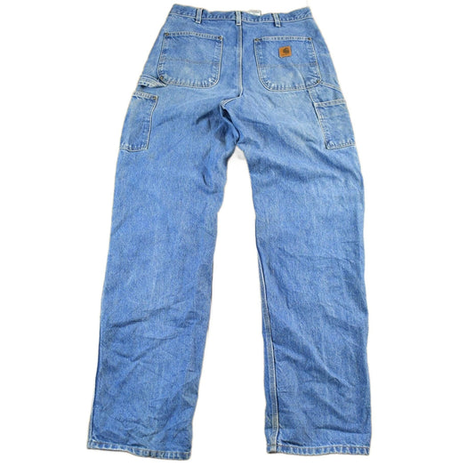 Vintage 2000s Carhartt Distressed Double Knee Denim Work Jeans Men's Medium 33 x 36 from propervintagecanada