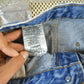 Vintage 2000s Carhartt Distressed Double Knee Denim Work Jeans Men's Medium 33 x 36 from propervintagecanada