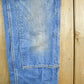 Vintage 2000s Carhartt Distressed Double Knee Denim Work Jeans Men's Medium 33 x 36 from propervintagecanada