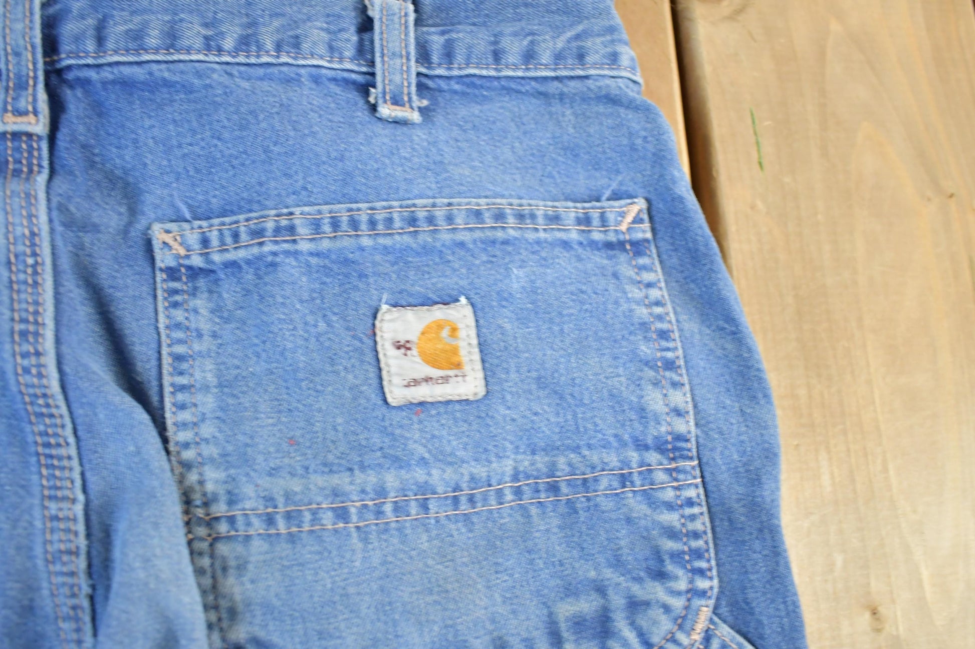 Vintage 2000s Carhartt Distressed Fire Resistant FR Workwear Denim Jeans Men's 32 x 30 from propervintagecanada