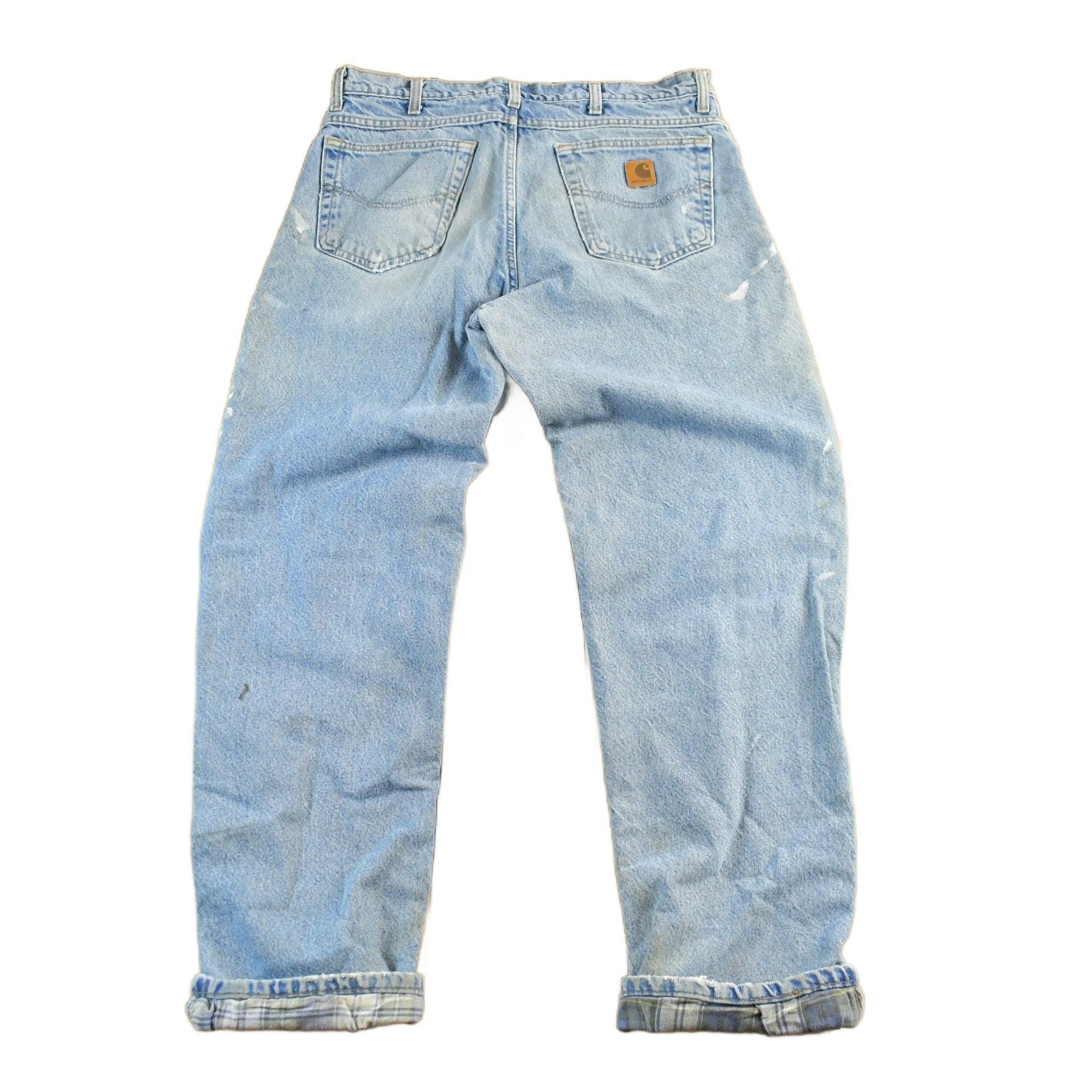 Vintage 2000s Carhartt Distressed Flannel Lined Denim Work Jeans Men's 34 x 33 from propervintagecanada