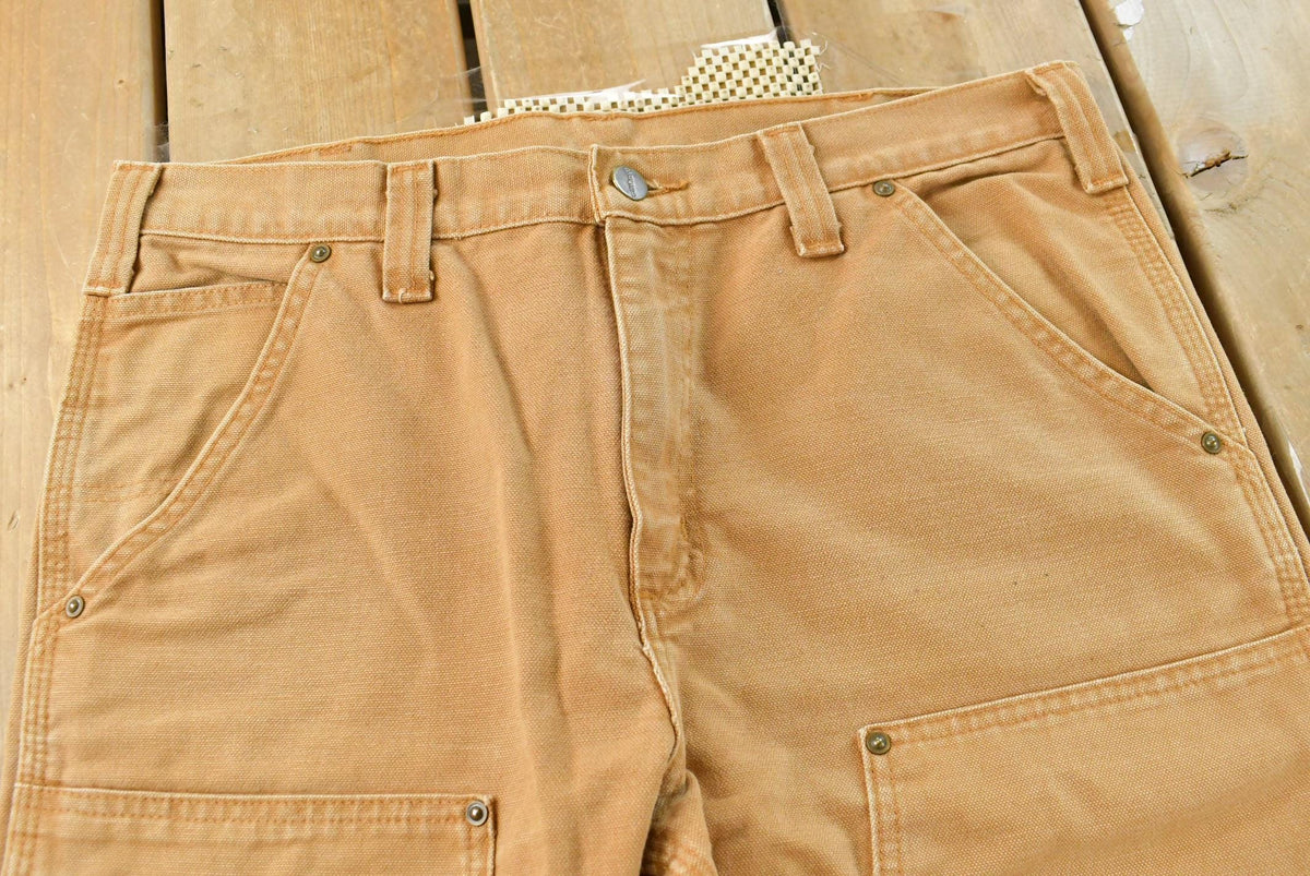 Vintage 2000s Carhartt Double Knee Tan Canvas Pants Men's 34 x 30 from propervintagecanada