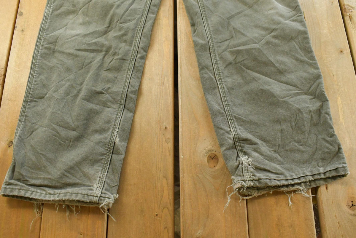 Vintage 2000s Carhartt Flannel Lined Green Work Jeans Men's 36 x 31 from propervintagecanada