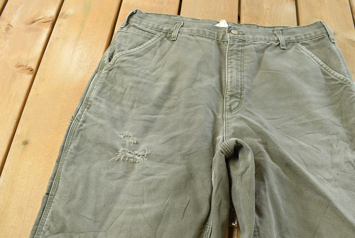 Vintage 2000s Carhartt Flannel Lined Green Work Jeans Men's 36 x 31 from propervintagecanada