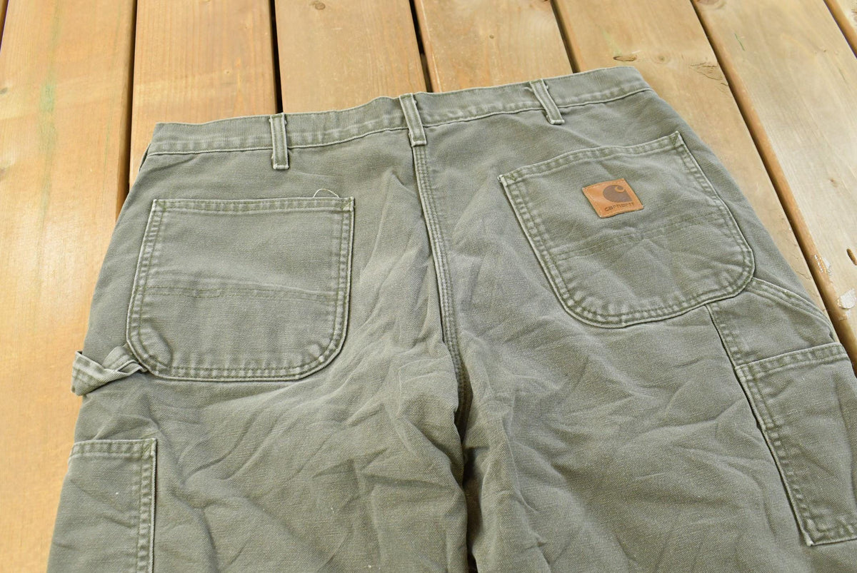 Vintage 2000s Carhartt Flannel Lined Green Work Jeans Men's 36 x 31 from propervintagecanada