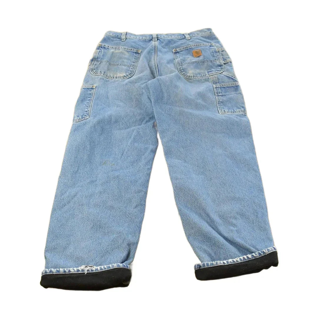 Vintage 2000s Carhartt Fleece Lined Denim Work Jeans Men's 35 x 31 from propervintagecanada