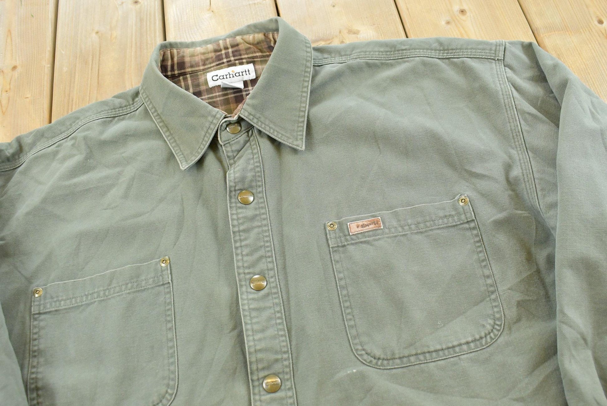 Vintage 2000s Carhartt Heavyweight Thrashed Lined Workwear Button Up Shirt Men's 2XL from propervintagecanada