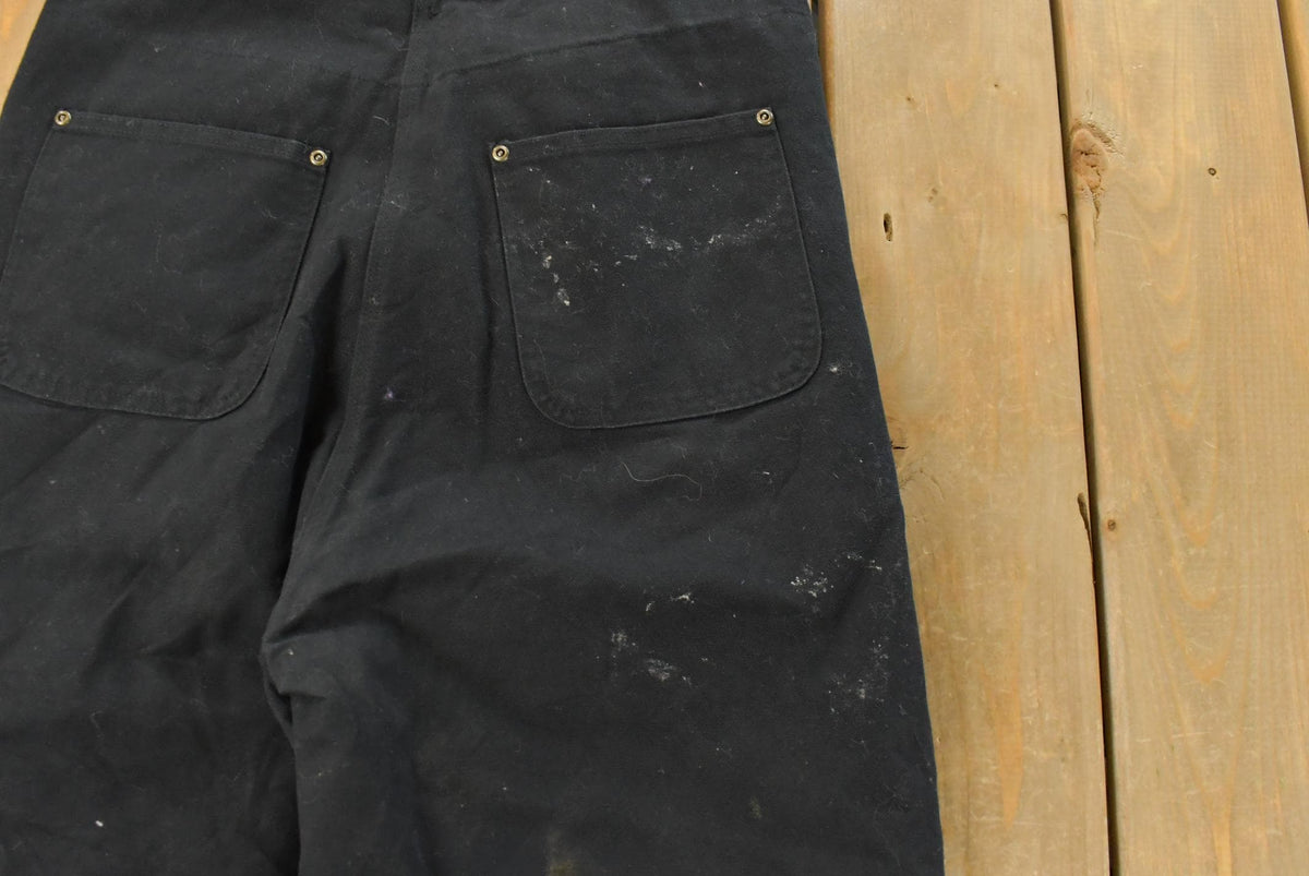 Vintage 2000s Carhartt Insulated Double Knee Canvas Bib Overalls Women's 32 x 26 from propervintagecanada
