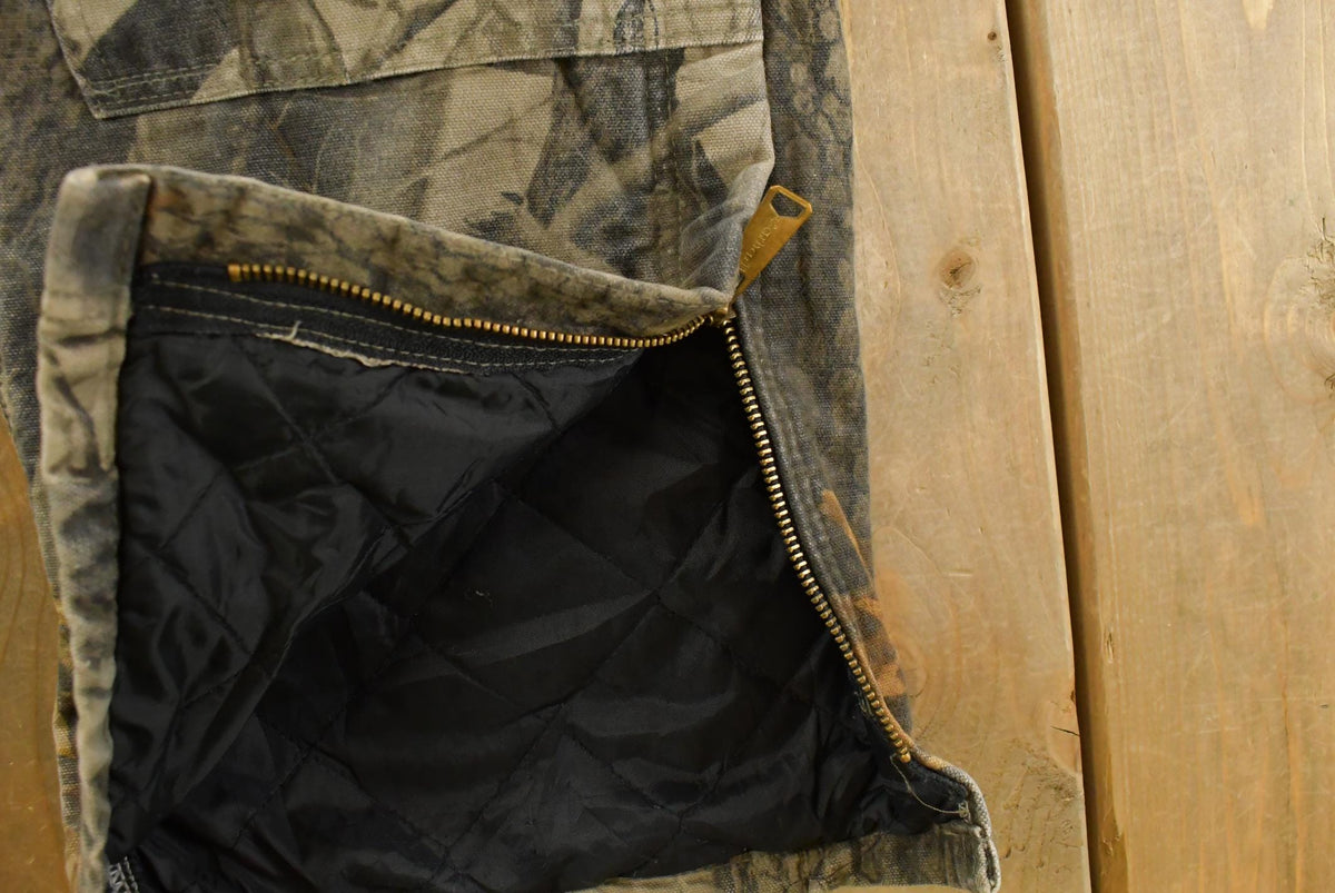 Vintage 2000s Carhartt Insulated Real Tree Camo Canvas Bib Overalls Men's 32 x 28 from propervintagecanada