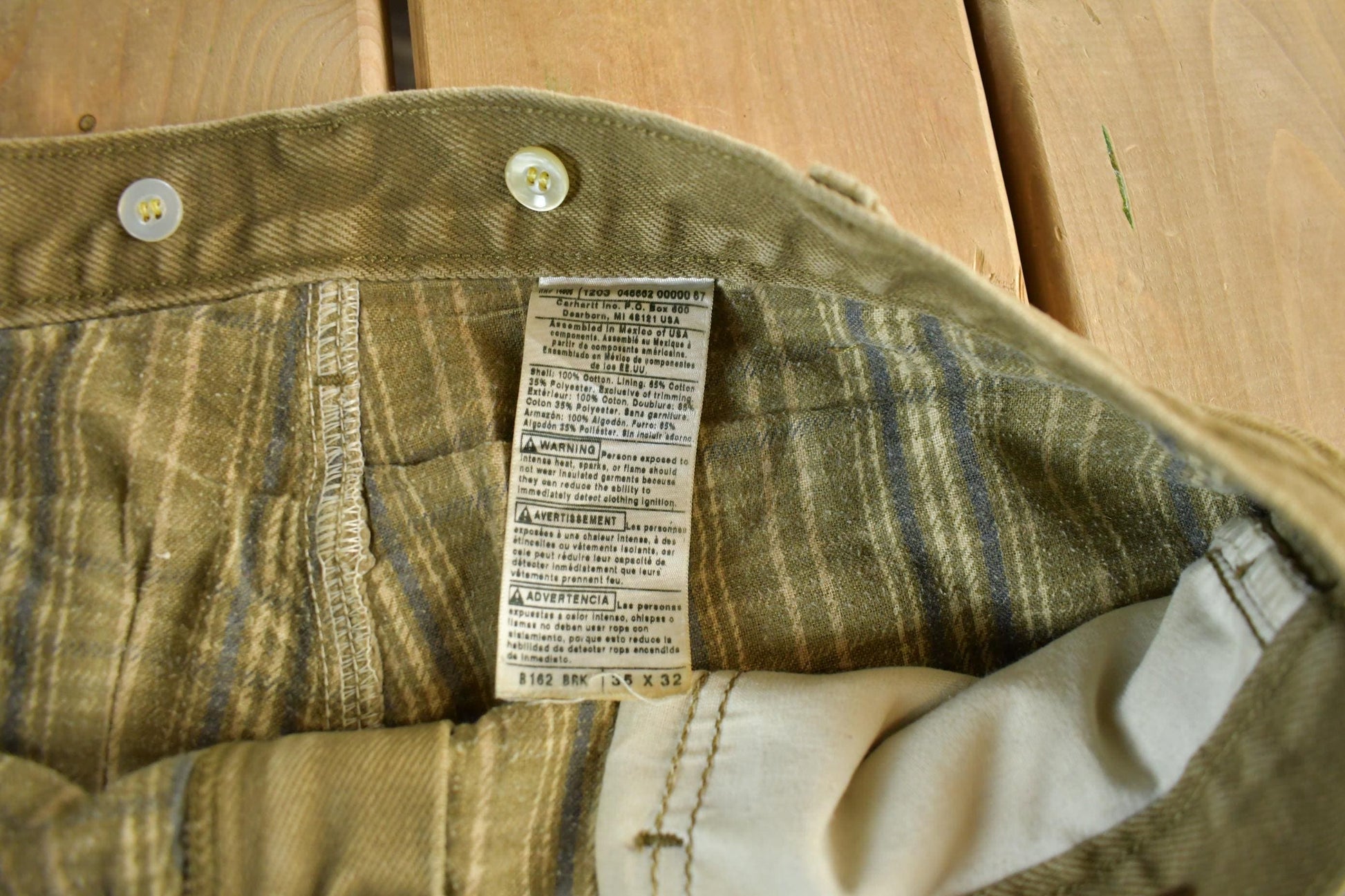 Vintage 2000s Carhartt Lined Carpenter Work Denim Jeans Men's 34 x 31 from propervintagecanada