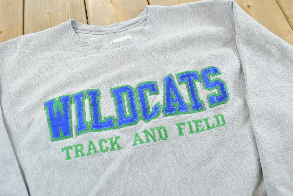 Vintage 2000s Champion Wildcats Track & Field Crewneck Sweatshirt Men's M from propervintagecanada