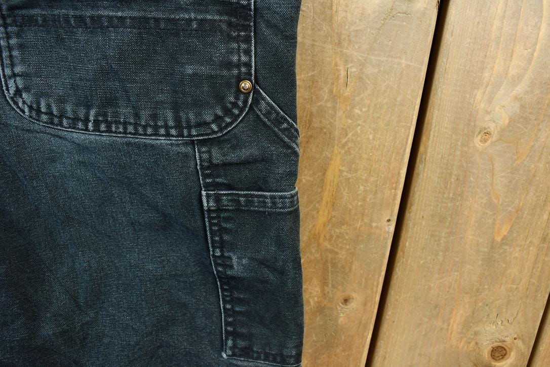 Vintage 2000s Double Knee Riveted Carhartt Dungaree Work Pants Men's Small 29 x 30 from propervintagecanada
