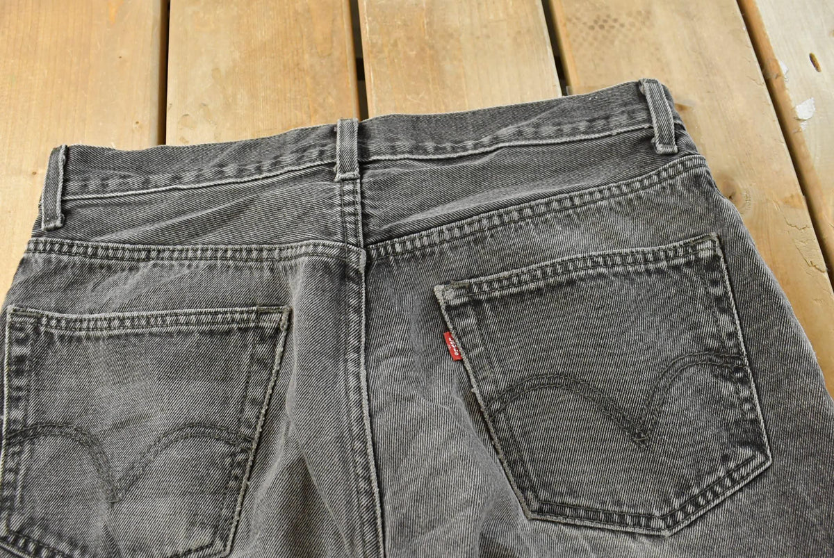 Vintage 2000s Levi's 505 Regular Straight Fit Starched Denim Black Jeans Men's 33 x 27.5 from propervintagecanada