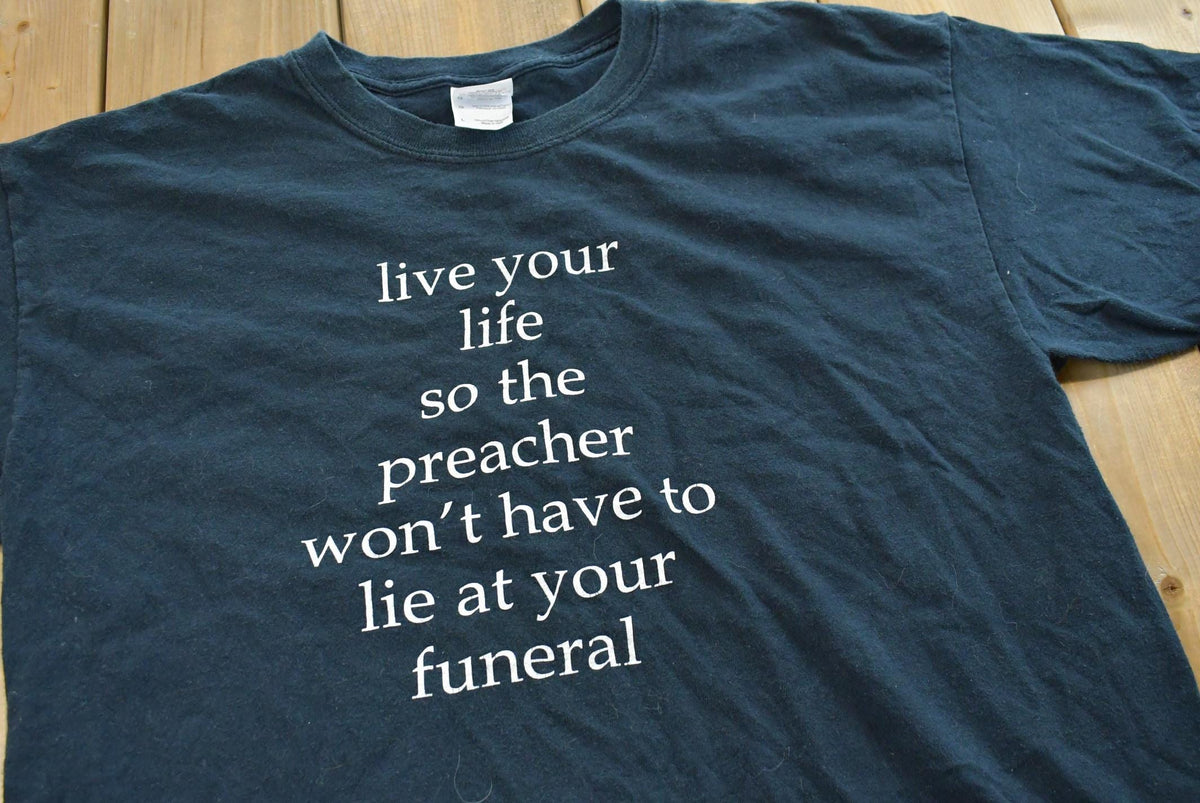 Vintage 2000s Live Your Life Funeral Preacher Funny Saying Souvenir T-Shirt Mens XL from propervintagecanada