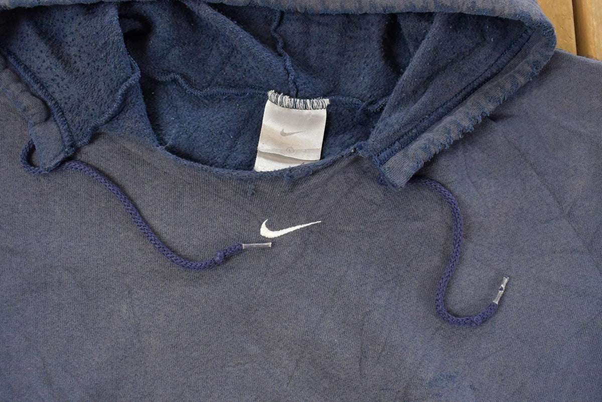 Vintage 2000s Thrashed Nike Embroidered Mini Middle Swoosh Hoodie Men's L from propervintagecanada