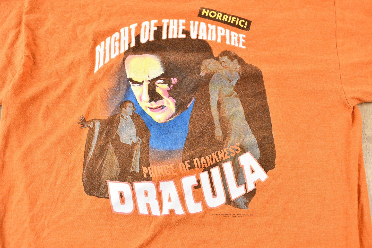 Vintage 2005 Dracula Night of the Vampire Orange and Blue Ringer Graphic T-Shirt Men's Large from propervintagecanada
