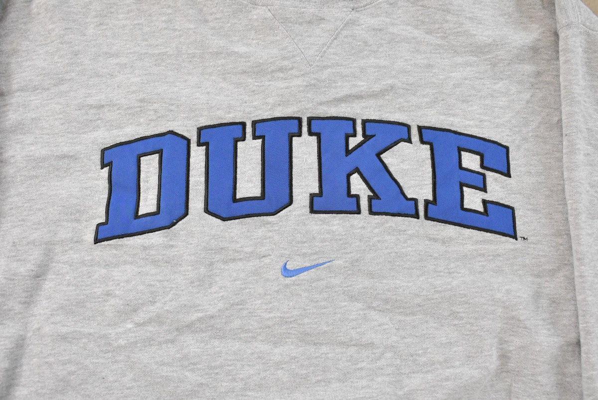 Vintage 90s Duke Blue Devils Nike Middle Swoosh Crewneck Sweatshirt Men's M-L from propervintagecanada