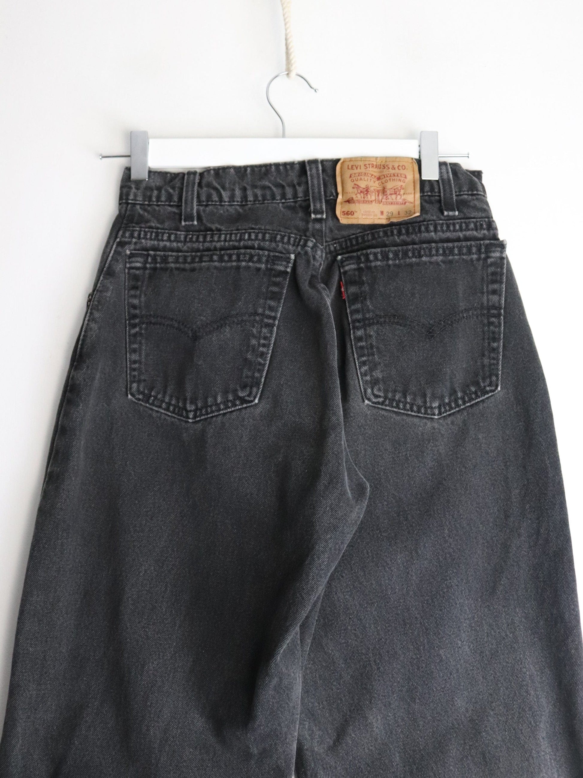 Vintage Levi's Denim Jeans Mens 27 x 31 Black 560 Loose Tapered from propervintagecanada