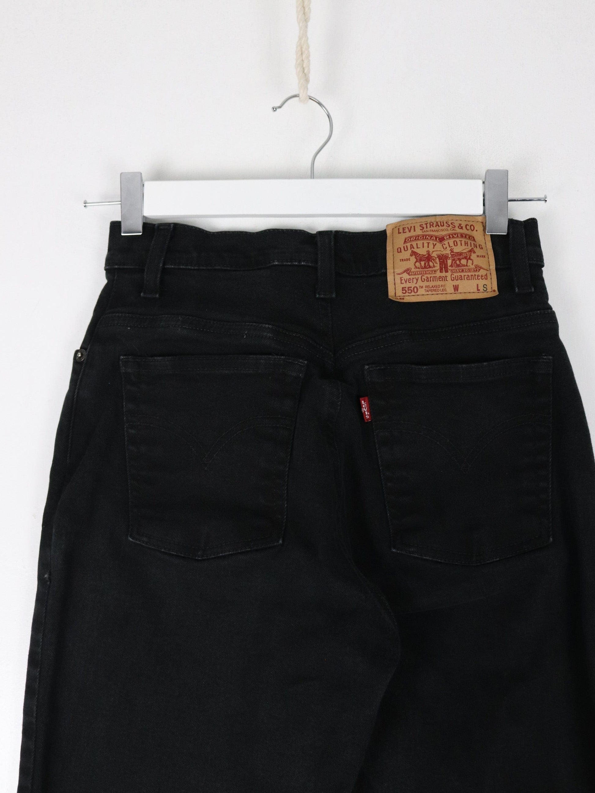 Vintage Levi's Pants Womens 4 Black Denim Jeans 550 Relaxed Tapered 25 x 28 from propervintagecanada