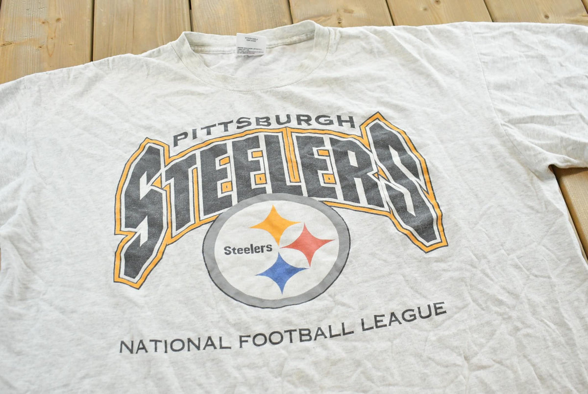 Vintage Logo Athletic 1990s Pittsburgh Steelers NFL Logo Athletic T-Shirt Mens 2XL from propervintagecanada
