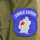 Vintage Military Jungle Expert Peace Sign Button Up Army Jacket from propervintagecanada
